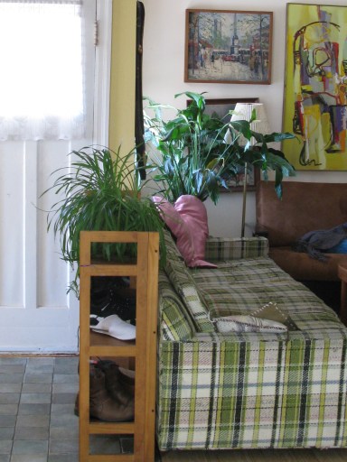 Shoe shelf behind the couch offers added protection and a convenient place to put shoes.
