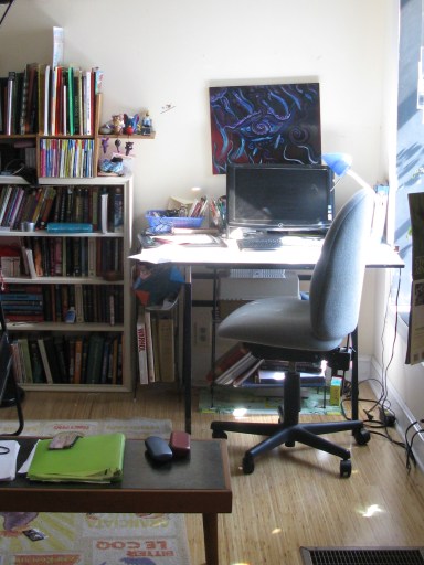 A workstation now occupies the wall that faced the door.